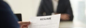 Image of person holding resume