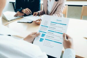person holding a resume