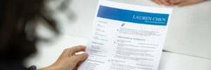 interviewer holding a resume